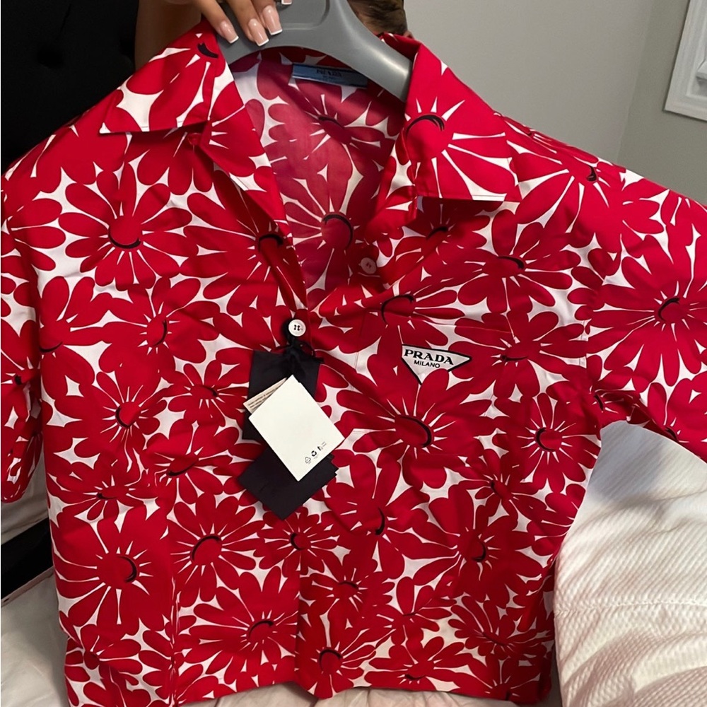 This is a Prada button up shirt , it’s brand new with tags on it